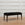 In Stock Tapered Leg Bench with Blackened Base and Jet Black Hair on Hide, 42"L