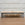 In Stock Monaco Bench with Blackened Base and Hair on Hide, 51"L