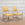 Pair of White Cerused Oak Arm Chairs with Carved Elements and Yellow Upholstery