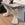 Pair of Monumental Console Tables with Weathered Portoro Marble Tops and Cast Stone Lion's Paw Feet