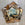 Faceted Mirror with Paint Decorated Trim and Distressed Glass Panels in the Manner of Serge Roche