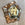 Faceted Mirror with Paint Decorated Trim and Distressed Glass Panels in the Manner of Serge Roche