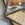 Faceted Mirror with Paint Decorated Trim and Distressed Glass Panels in the Manner of Serge Roche