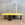 In Stock Offset Coffee Table with Blackened Base and Yellow Leather Top (SOLD)